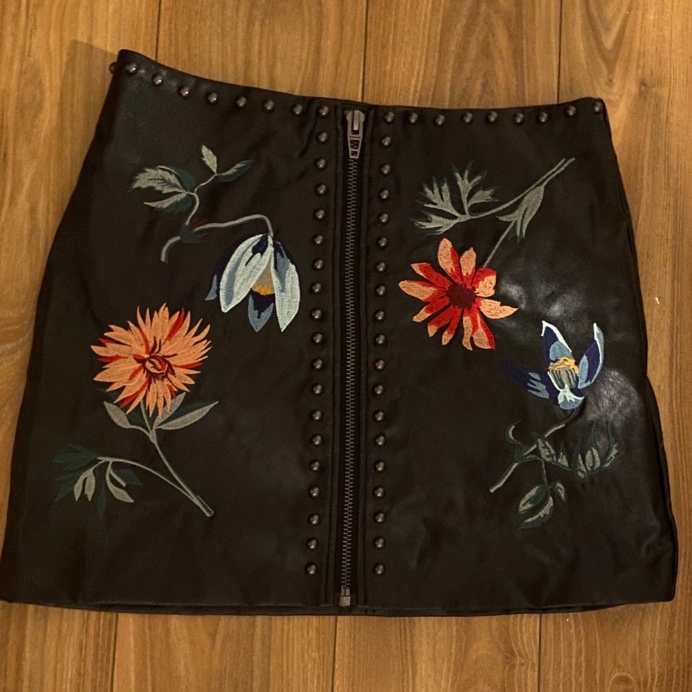 Black faux leather and embroidered miniskirt
